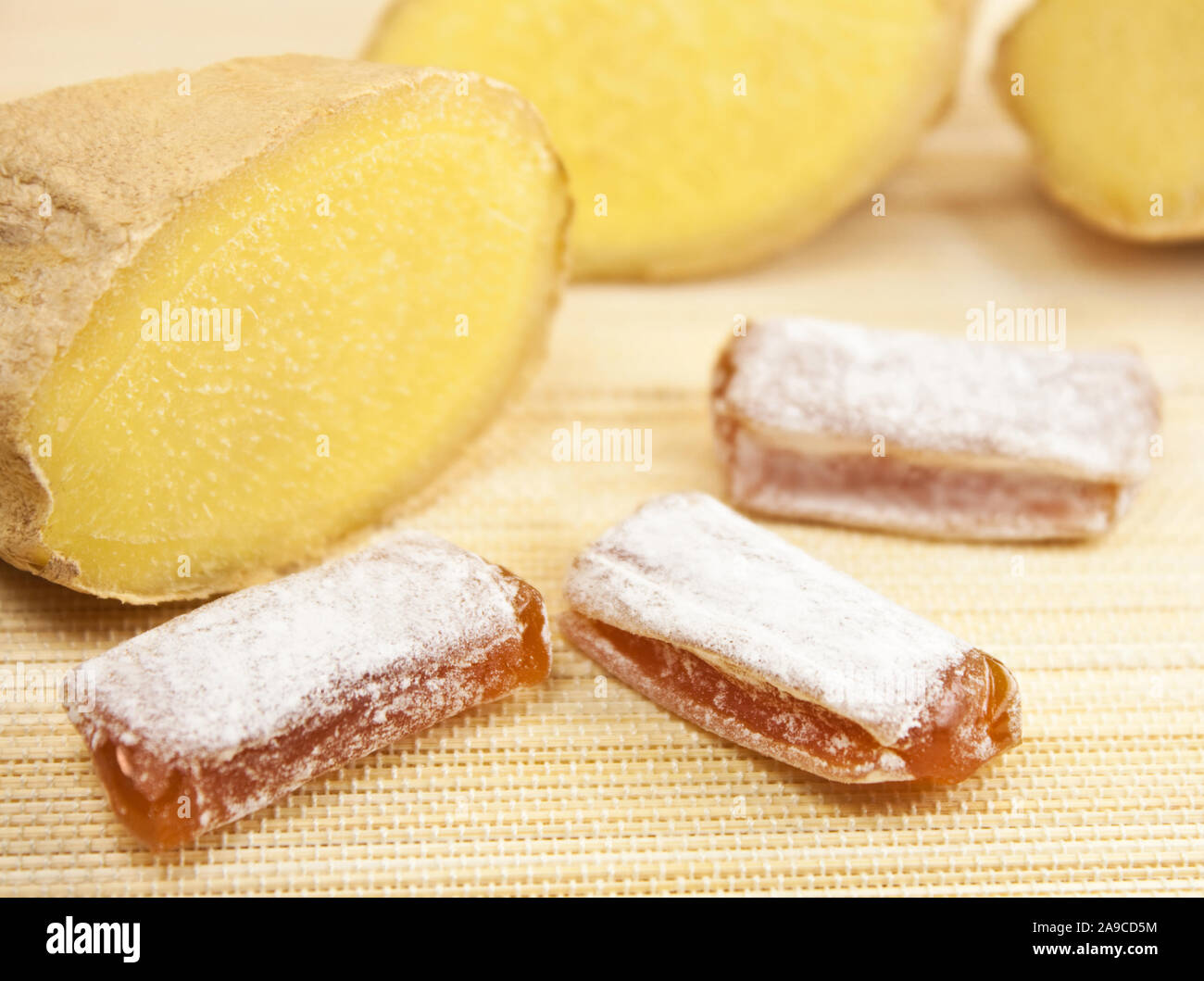 Ginger candy sweets and fresh root Stock Photo Alamy