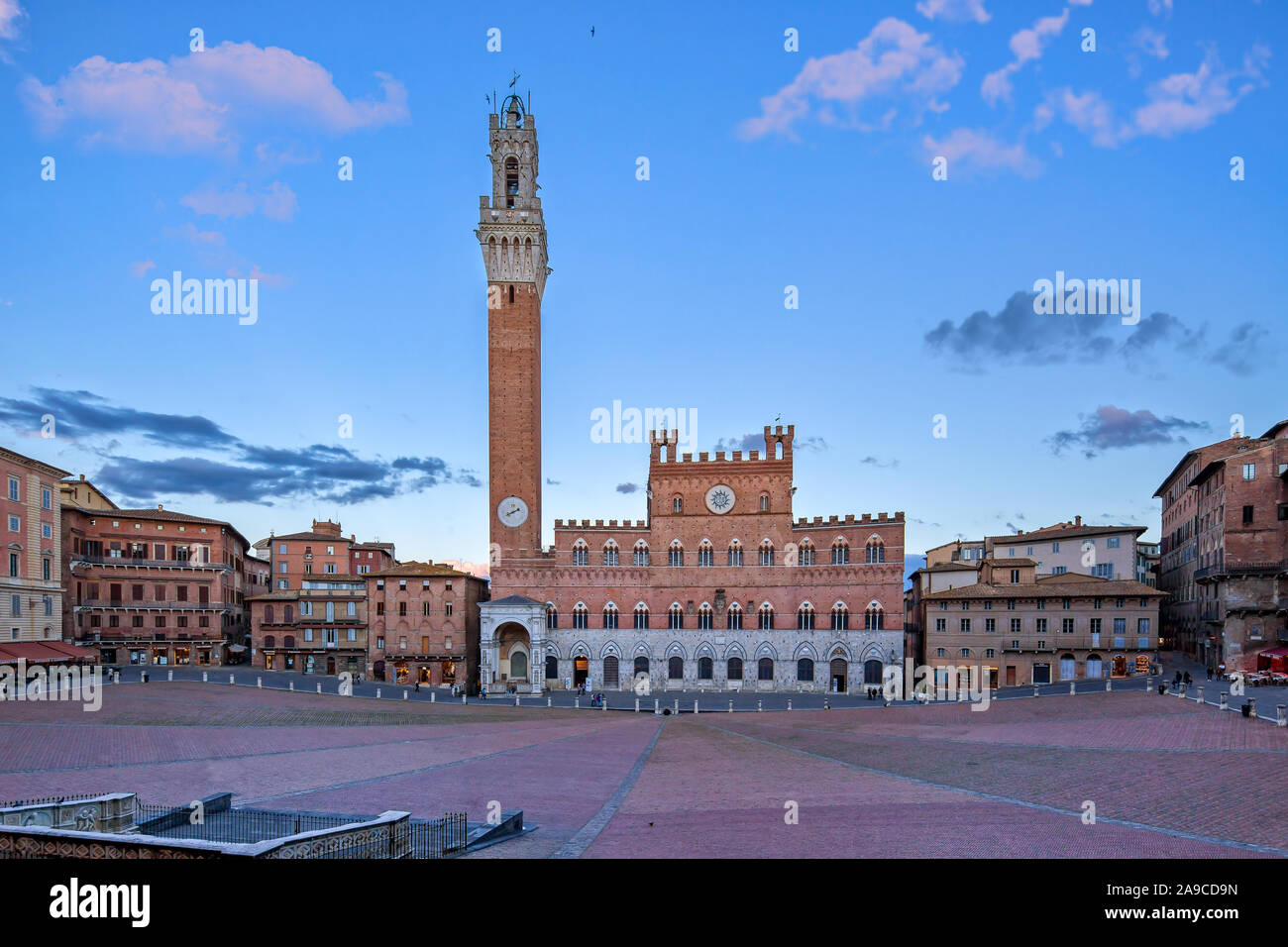 Panoramic view of the famous Piazza del Campo, Palazzo Pubblico and the Torre Del Mangia in Siena at sunset, Tuscany, Italy Stock Photo