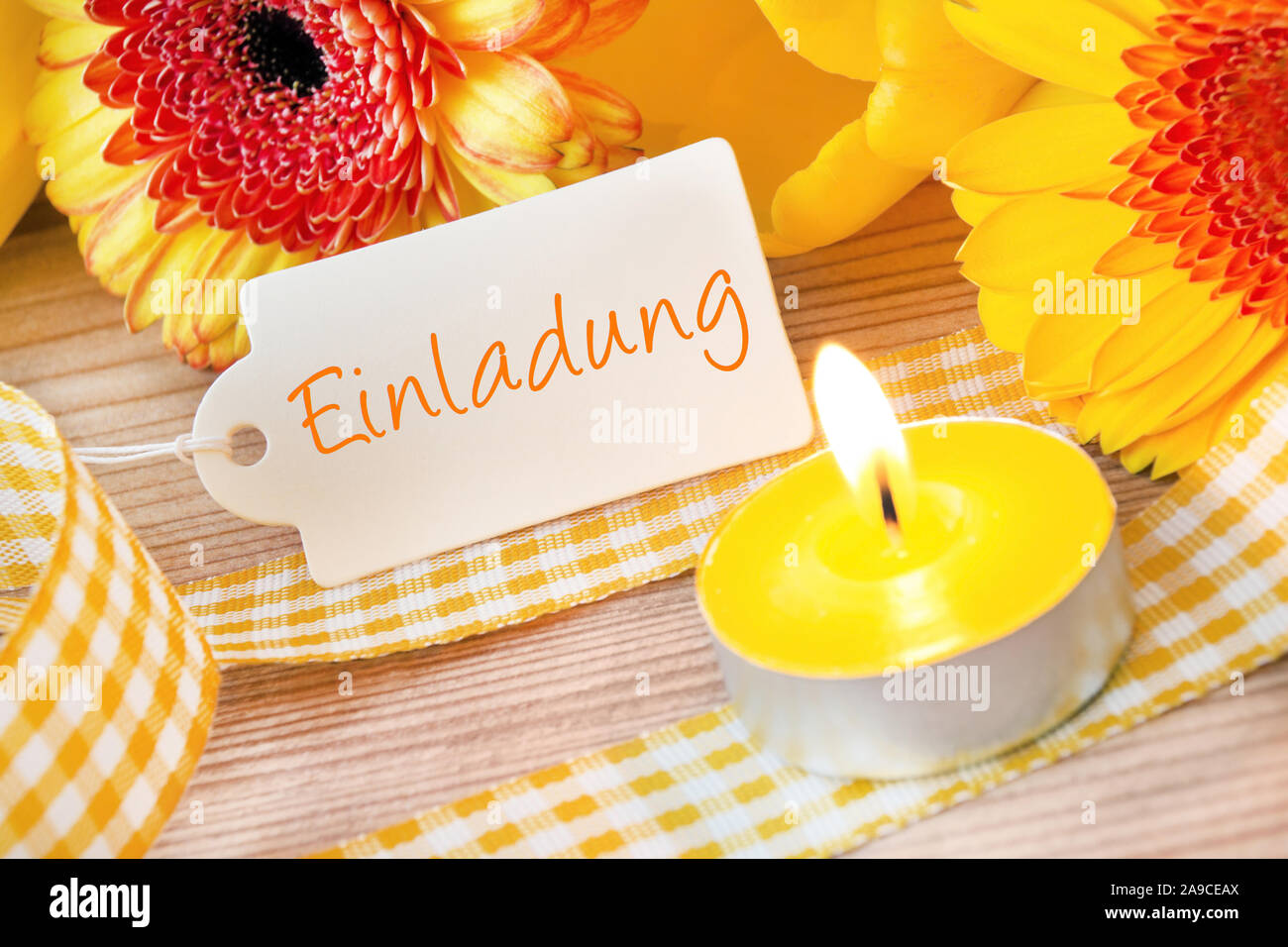 German invitation card and flowers with candles Stock Photo Alamy