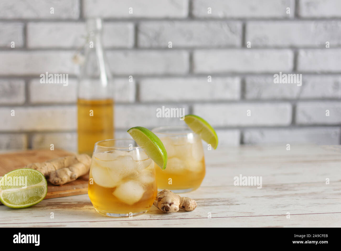 Fresh Ginger Ale with lime and ice or Kombucha in Bottle Homemade