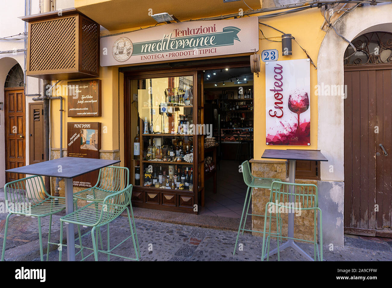A small wine bar/delicatessen in Cefalú, Sicily. The town has many small bars and restaurants among its narrow streets Stock Photo