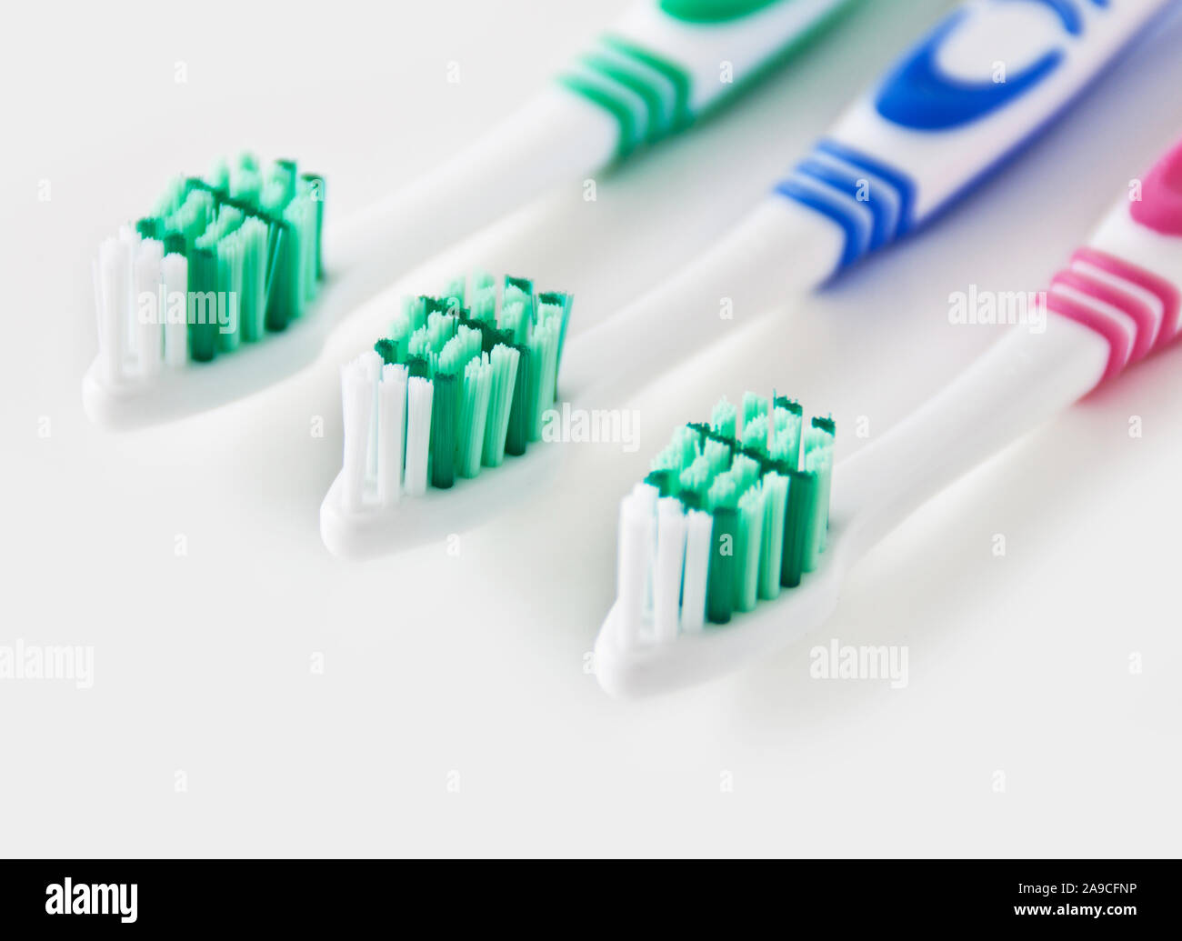 Various toothbrushes and white background Stock Photo - Alamy