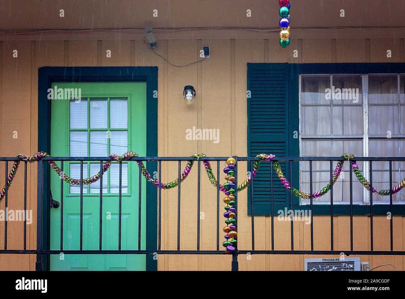 A Mardi Gras garland hangs from a balcony at Value Travel Inn, February 4, 2010, in Slidell, Louisiana. Stock Photo