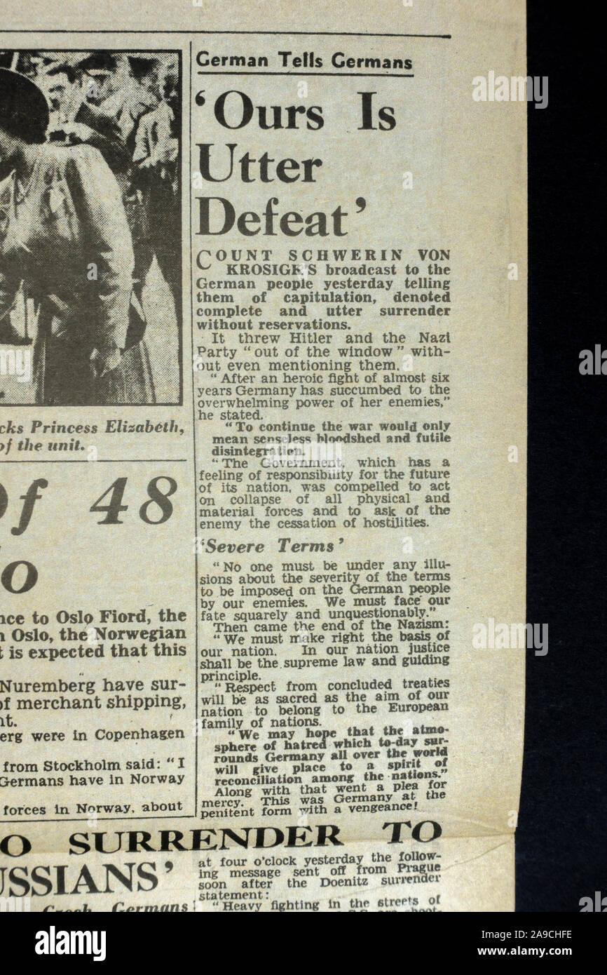 'Ours is Utter Defeat' headline highlighting surrender of the German in The Daily Sketch (replica) newspaper from 8th May 1945 celebrating VE Day. Stock Photo