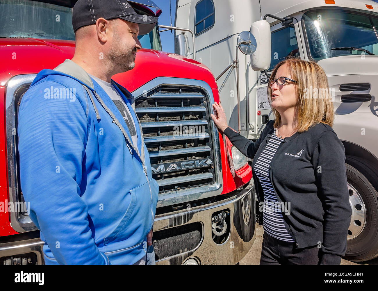 The general manager of Interstate Trucksource talks with a customer, May 7, 2018, in Romulus, Michigan. Stock Photo