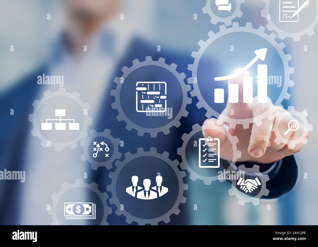 Professional project manager presenting management skills concept on interface with icons of planning schedule of tasks and deliverables, budget, team Stock Photo