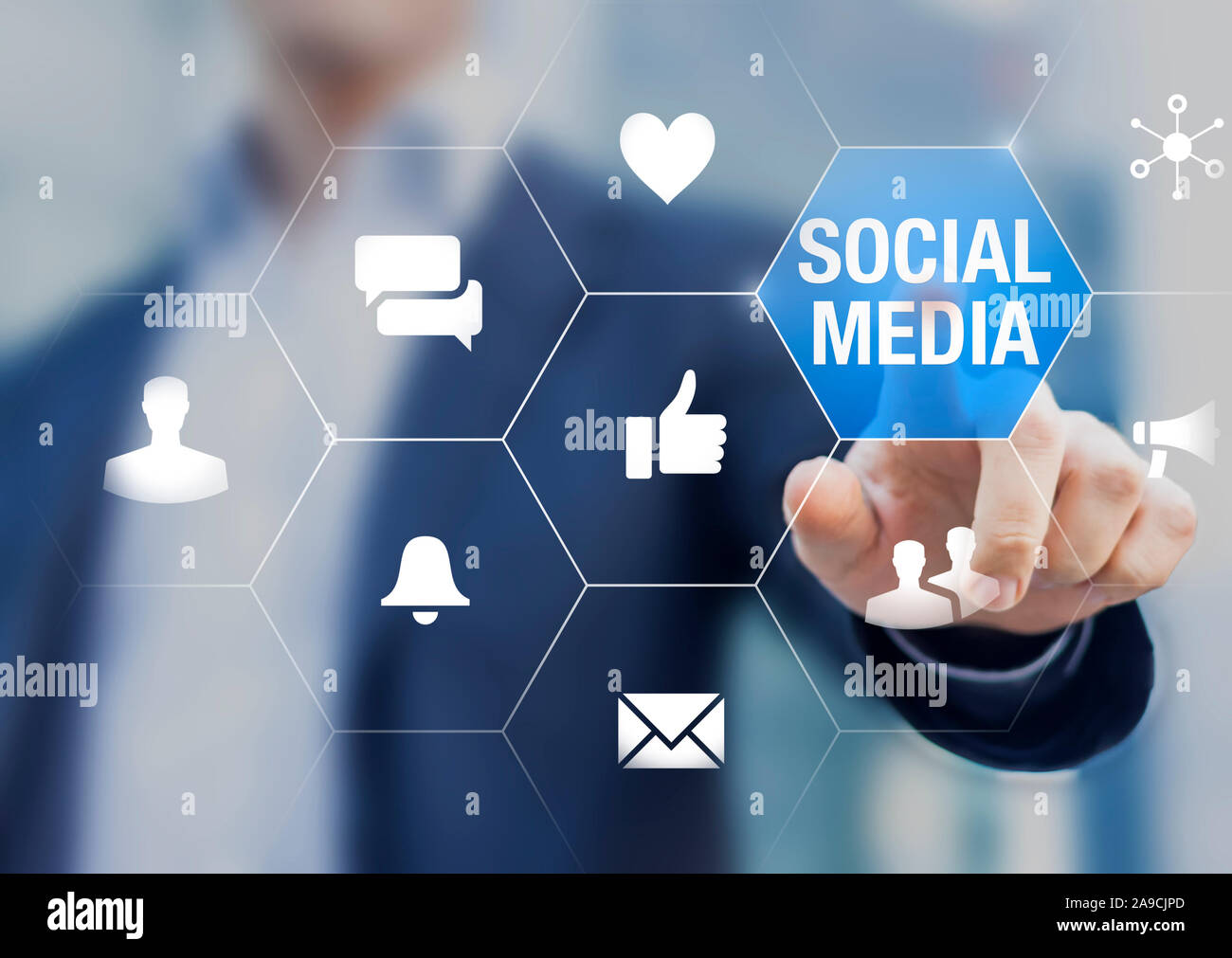 Social media network community manager touching icons about reputation on internet with likes, love, messages, shares and viral advertisement, online Stock Photo