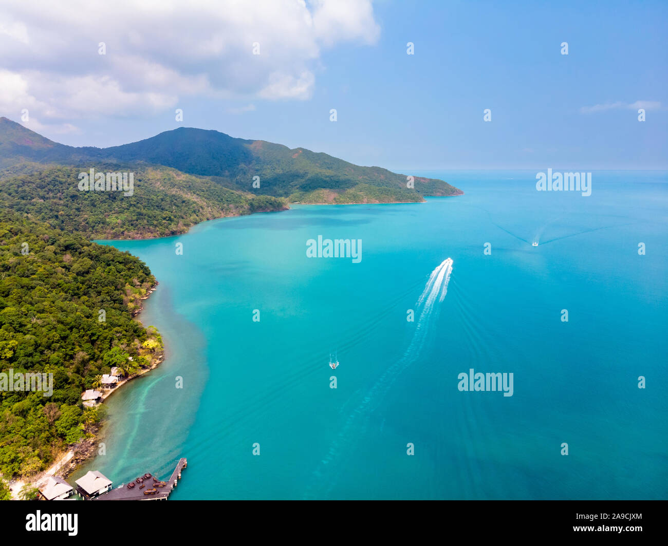 Aerial view of tropical island coast and beaches with blue transparent sea and green rainforest, paradise summer vacation holidays destination, beauti Stock Photo