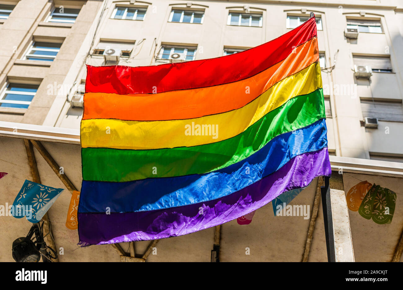 Rainbow flag at a Pride Day gay, lesbian, and LGBT parade. Stock Photo