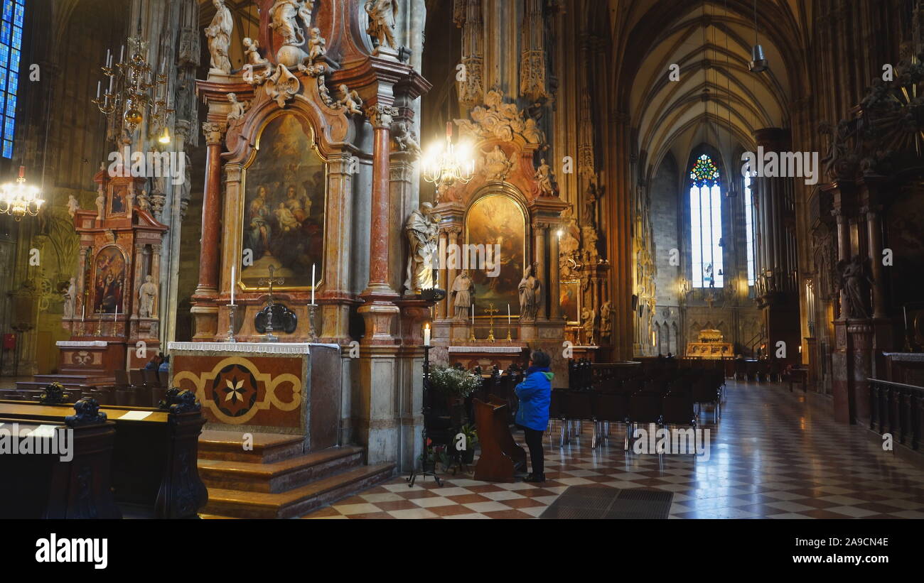 VIENNA, AUSTRIA-OCTOBER, 9, 2017: a worshiper at st stephen's cathedral in vienna, austria Stock Photo