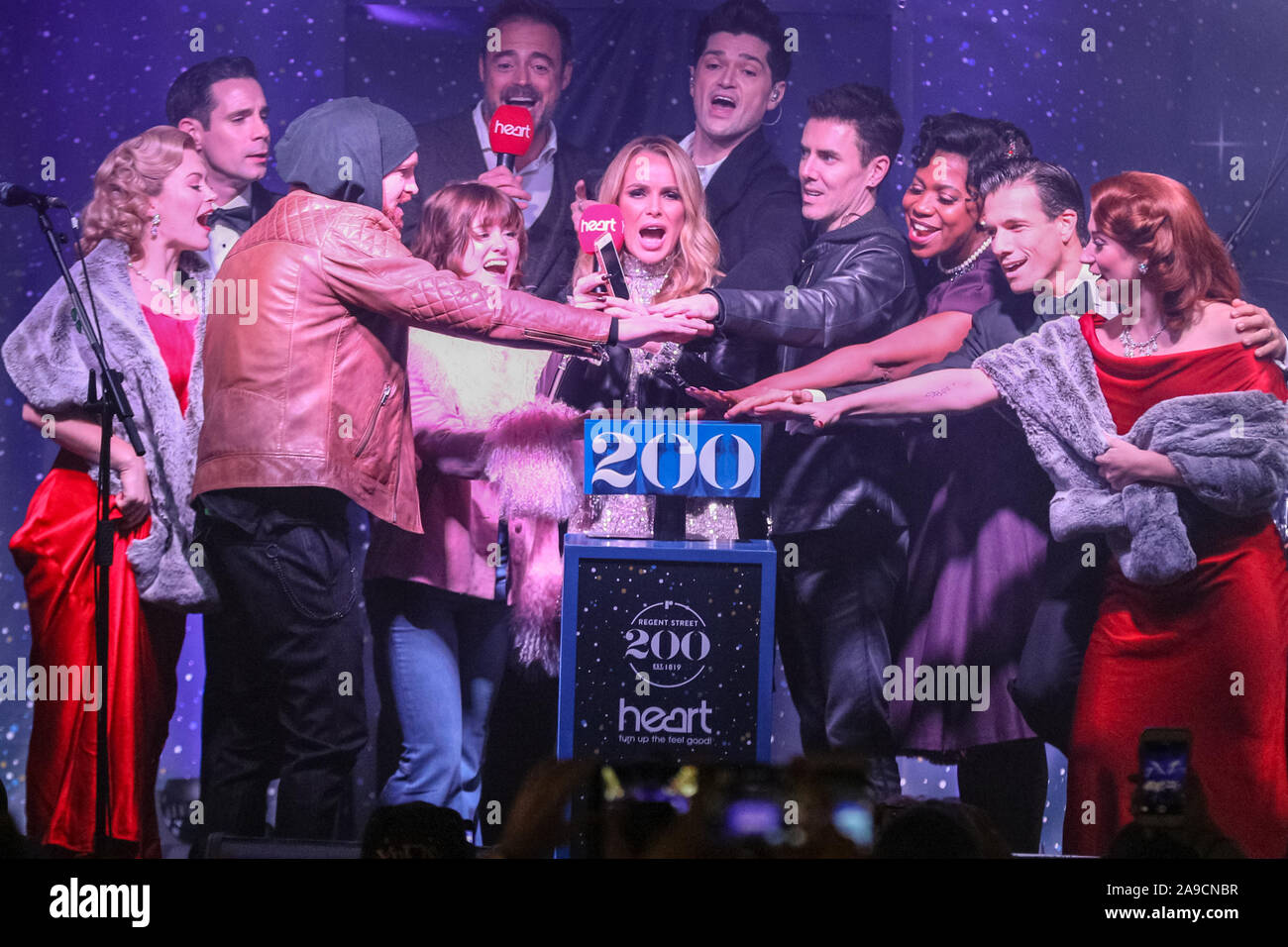 Regent Street, London, UK. 14th Nov, 2019. Maisie Peters, The Script, Jamie Theakston and Amanda Holden and the stars of 'White Christmas' officially switch on the lights. The largest Christmas Light installation in London, Regent Street's 'The Spirit of Christmas', featuring illuminated angels spreading their wings, is switched on with a program of stage appearances, performers, festive activities, food and drink. Credit: Imageplotter/Alamy Live News Stock Photo