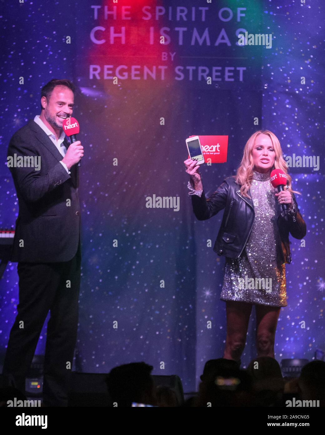 Regent Street, London, UK. 14th Nov, 2019. Heart FM presenters Jamie Theakston and Amanda Holden.The largest Christmas Light installation in London, Regent Street's 'The Spirit of Christmas', featuring illuminated angels spreading their wings, is switched on with a program of stage appearances, performers, festive activities, food and drink. Credit: Imageplotter/Alamy Live News Stock Photo
