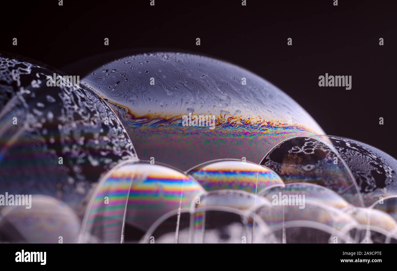Abstract macro of soap bubble. Close up surface of soap bubble seems ...