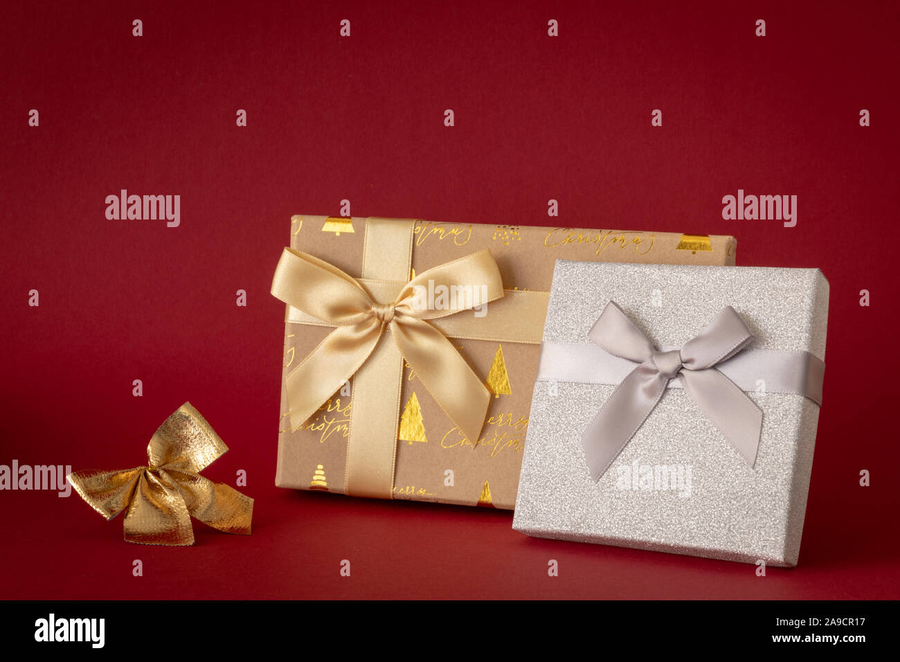 Christmas decoration with two gift boxes on red background Stock Photo