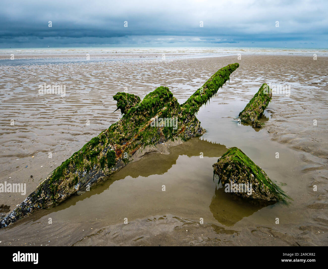 Sword like leftovers from a World War ship at a beach in northern France Stock Photo