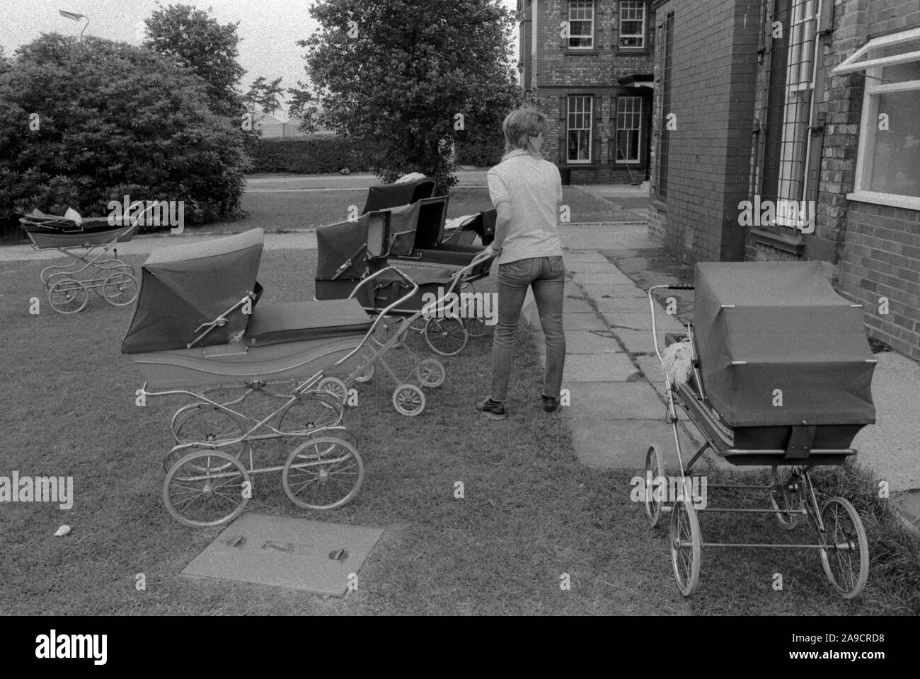 Prison UK 1986. New mother whos baby has been born in the prison, she will push the pram around the grounds. HM Prison Styal Wilmslow Cheshire 1980s. England HOMER SYKES Stock Photo