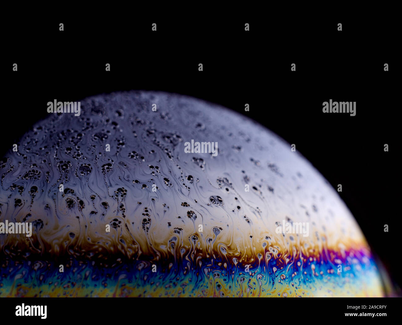 Abstract macro of soap bubble. Close up surface of soap bubble seems ...