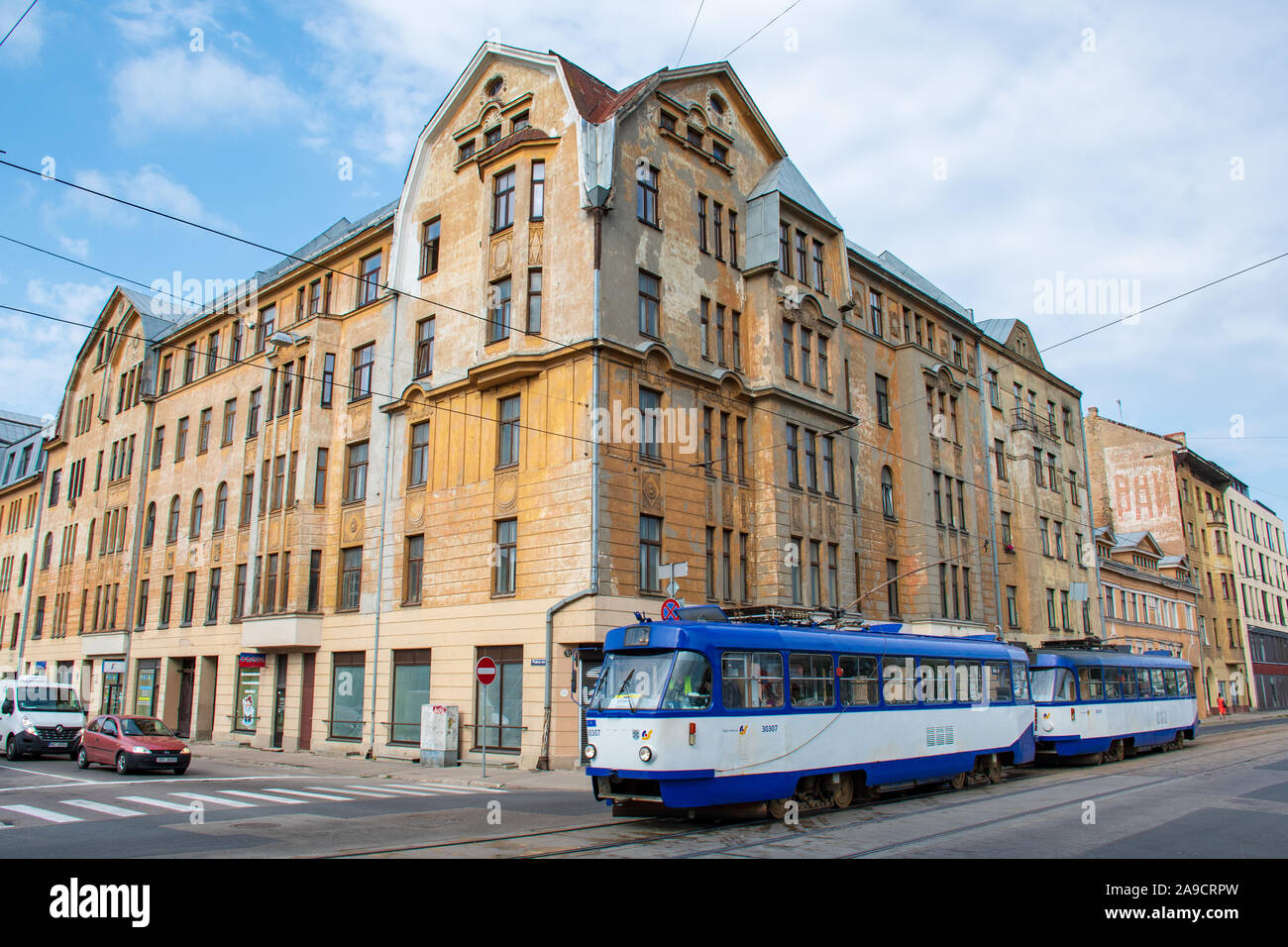Soviet era in Riga, Latvia. Old buildings with Cyrillic writings, Soviet architecture with old trolley bus in Riga Stock Photo