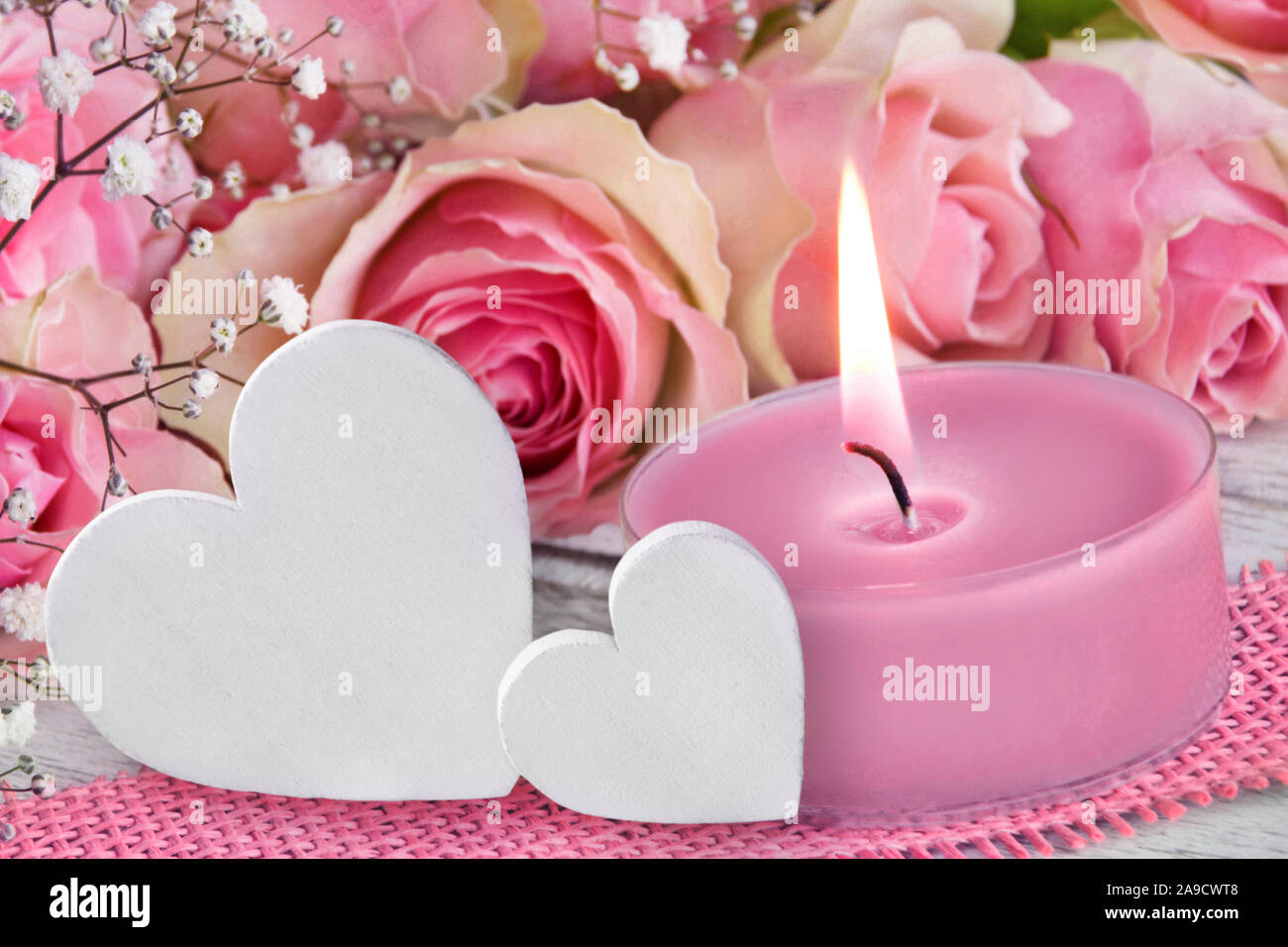 Pink heart shaped candles and rose Stock Photo by ©Subbotina 74125811