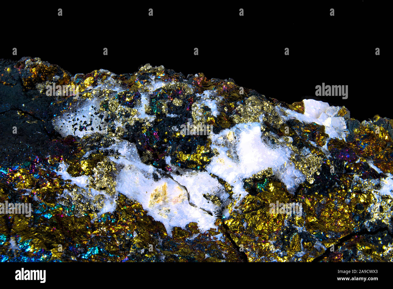 Macro of a chalcopyrite with small crystals and a variety of colors usable as background or wallpaper Stock Photo