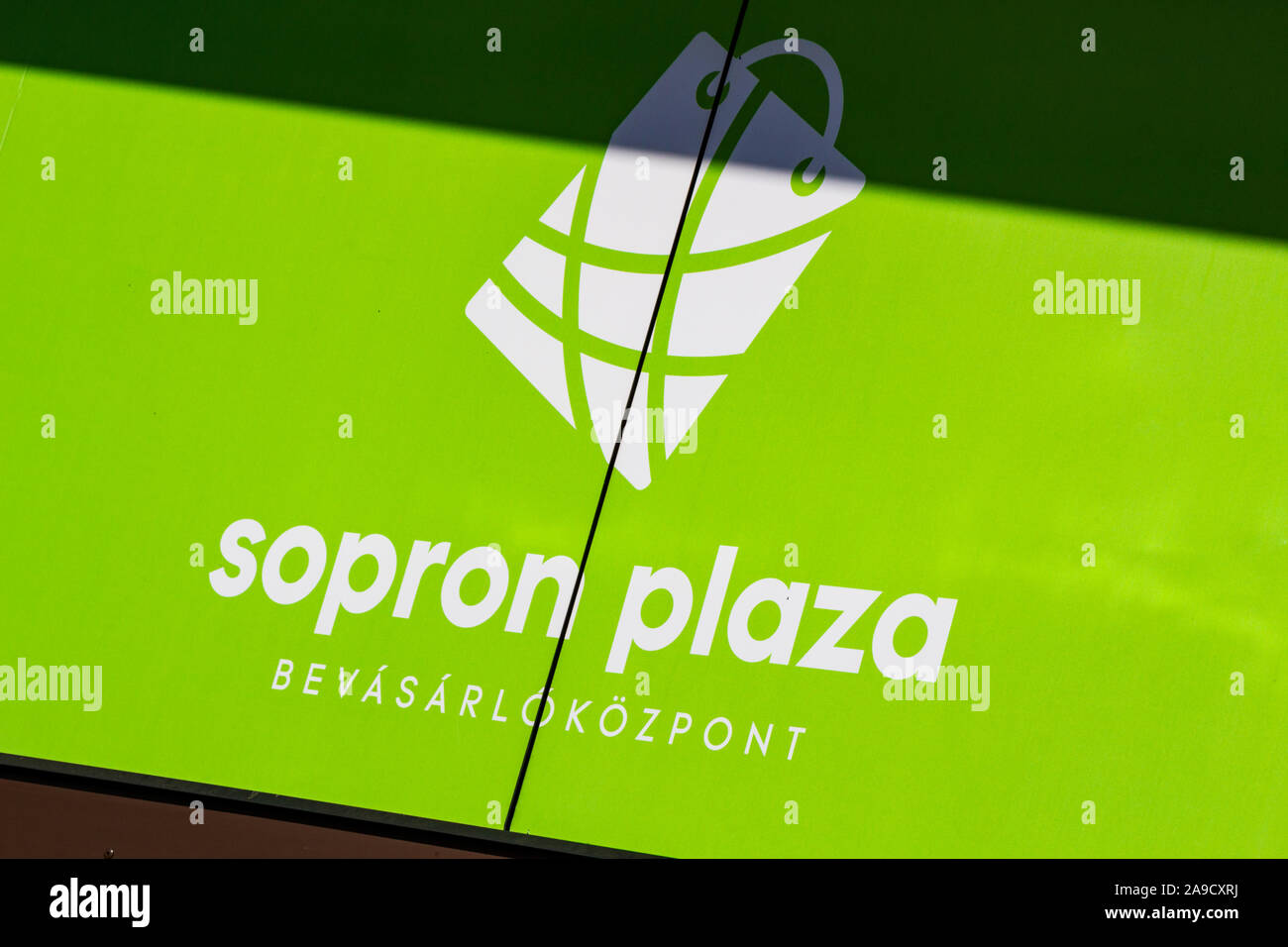 Sopron Plaza shopping centre center front sign, Sopron, Hungary Stock Photo