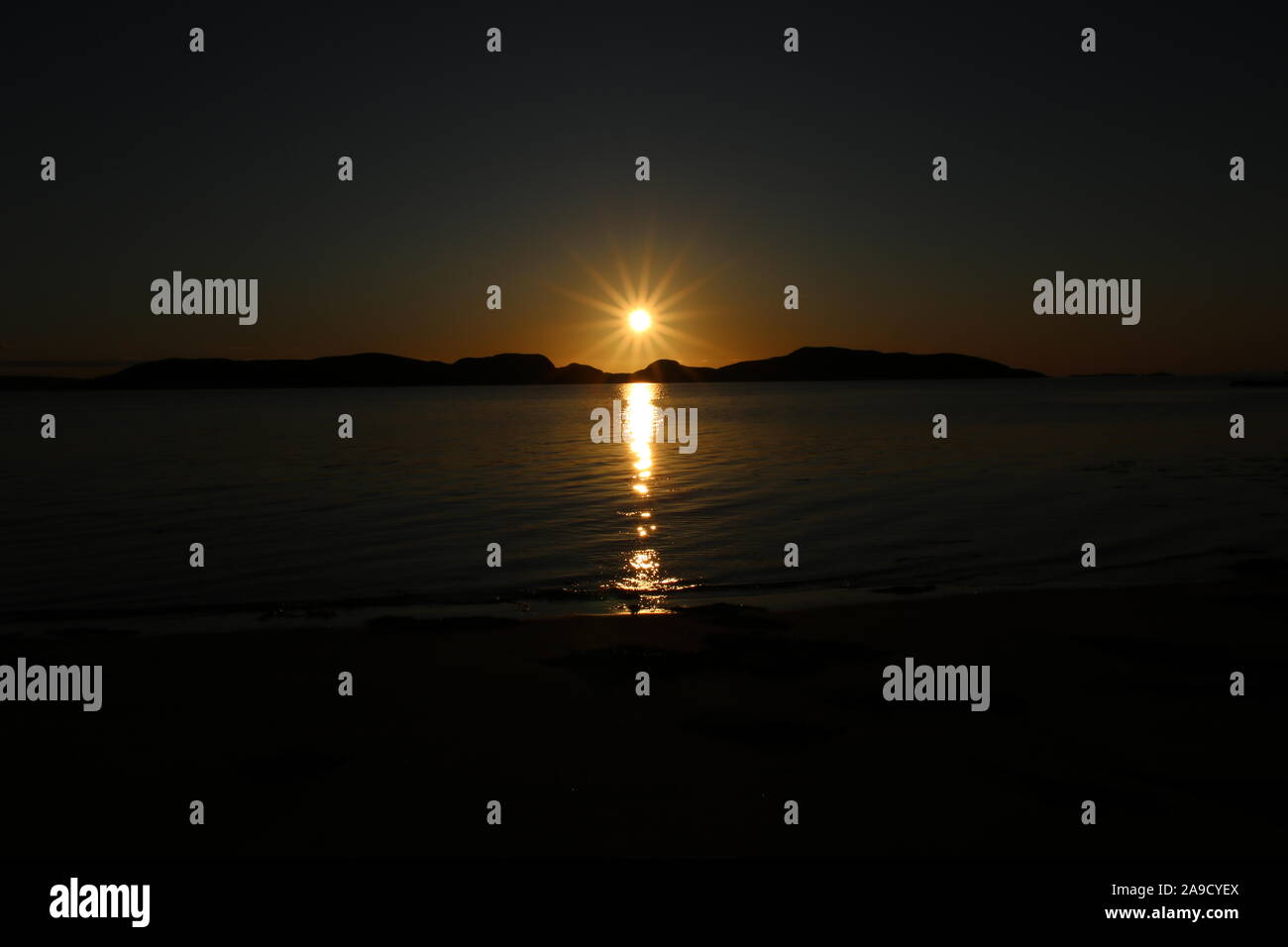 Twilight sunset over Achiltibuie coast onto the Summer Isles, Highlands, Scotland Stock Photo