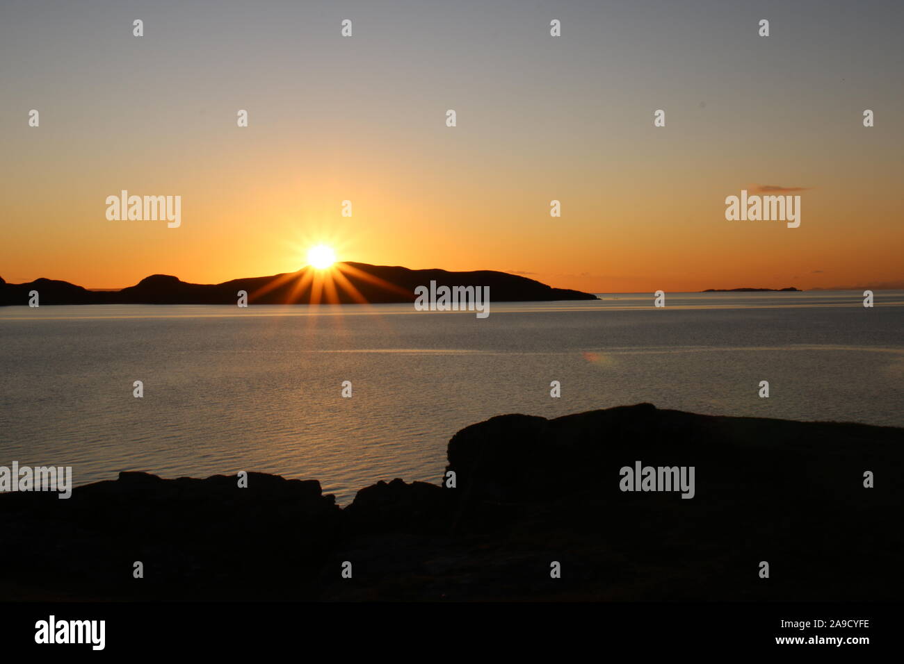 October sunset over the summer Isles on the Achiltibuie coast, Highlands, Scotland Stock Photo