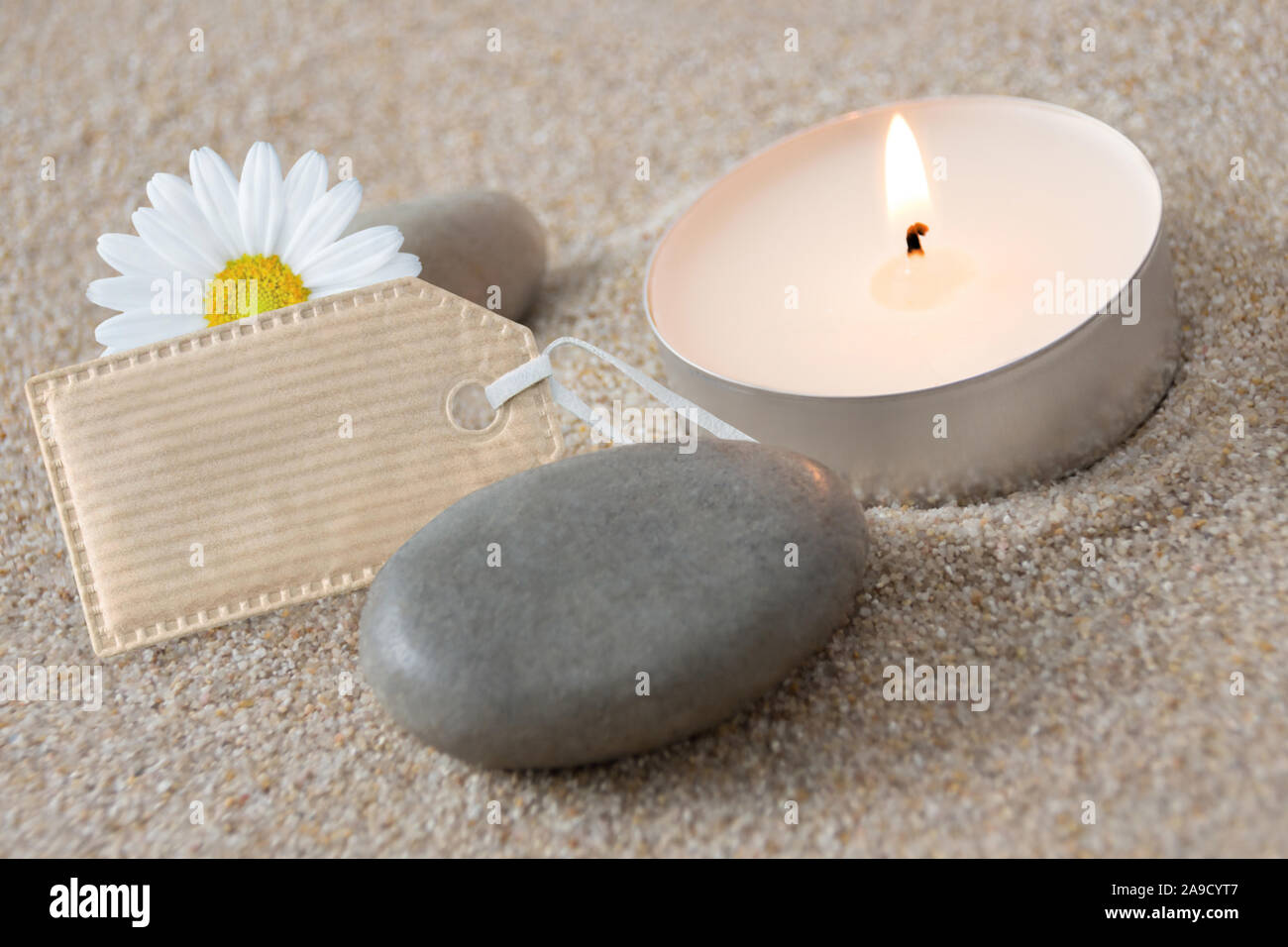 Wellness label and candle Stock Photo