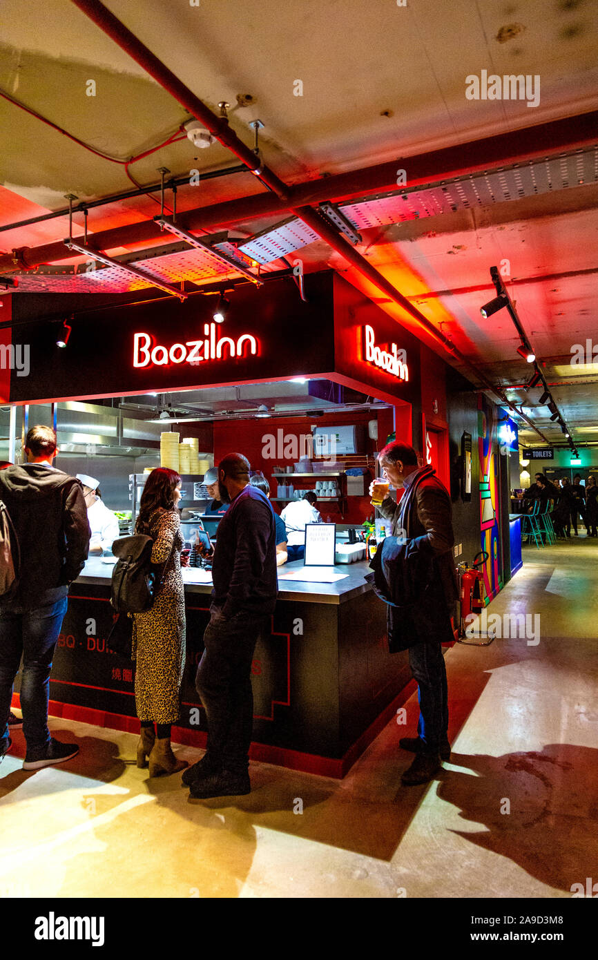 15th November 2019 - Opening of Market Hall West End, London, UK, people ordering at the BaoziInn stall Stock Photo