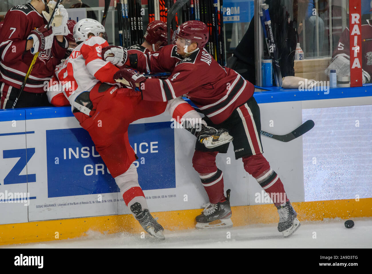 RIGA, Latvia. 14th Nov, 2019. Nerijus Alisauskas (R) makes a hit against Maxim Tsyplakov (L) of team Spartak, during Kontinental Hockey League (KHL) 2019/2020 season game, Dinamo Riga vs. Moscow Spartak Credit: Gints Ivuskans/Alamy Live News Stock Photo