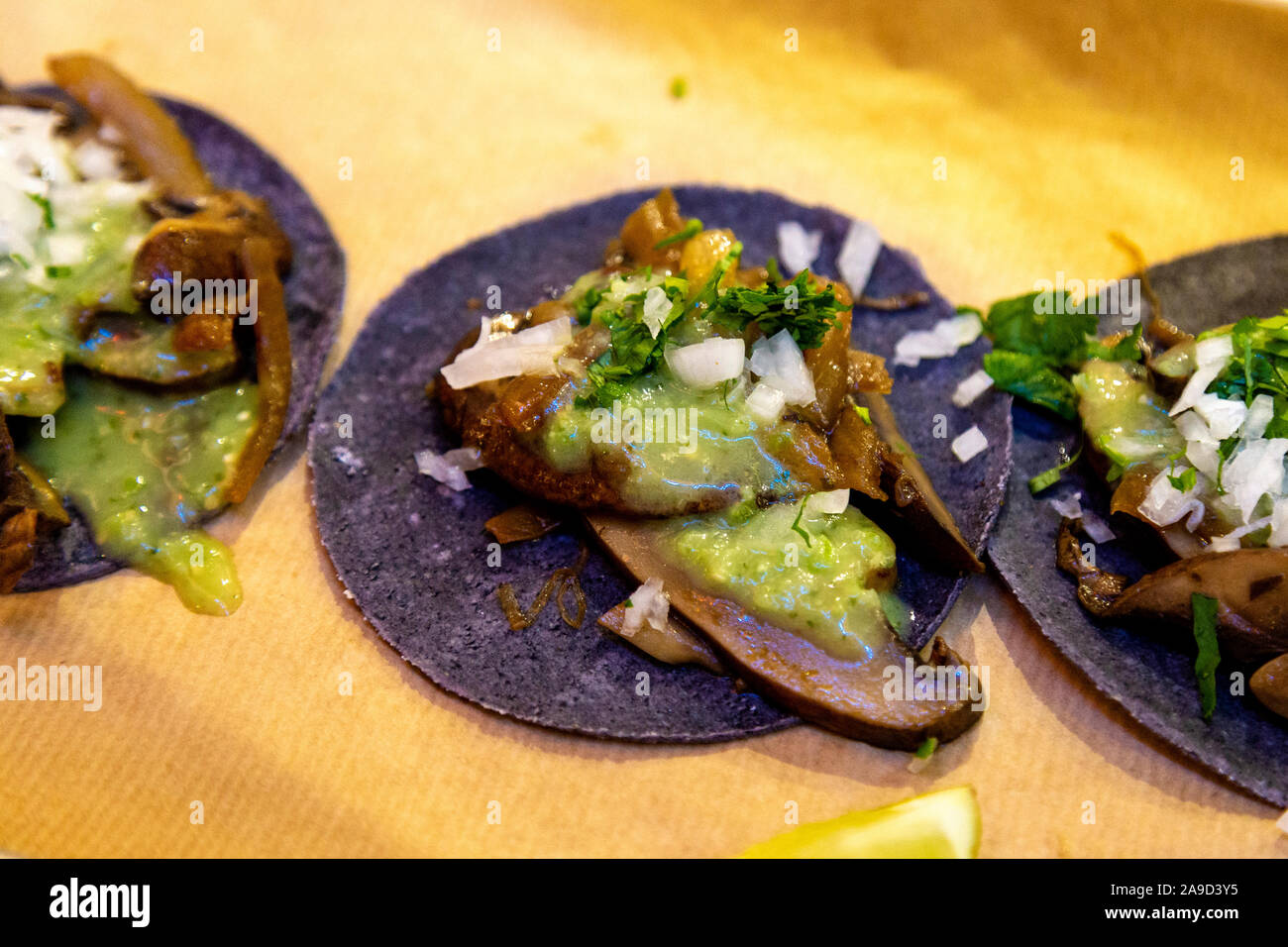 15th November 2019 - Opening of Market Hall West End, London, UK, mushroom tacos on black tortillas from the Super Tacos stall Stock Photo