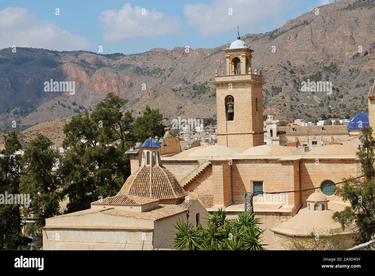 A view across the roof of the  fifteenth century Church of Santiago Apóstol, in Orihuela, Alicante Province, Spain, to the mountains beyond. Stock Photo