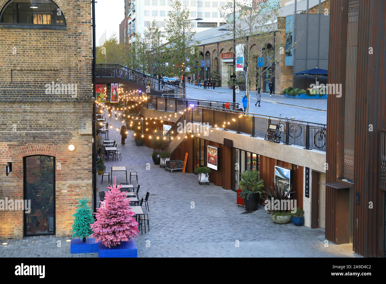 Lower Stable Street with Christmas lights, by Granary Square, KX, north London, UK Stock Photo