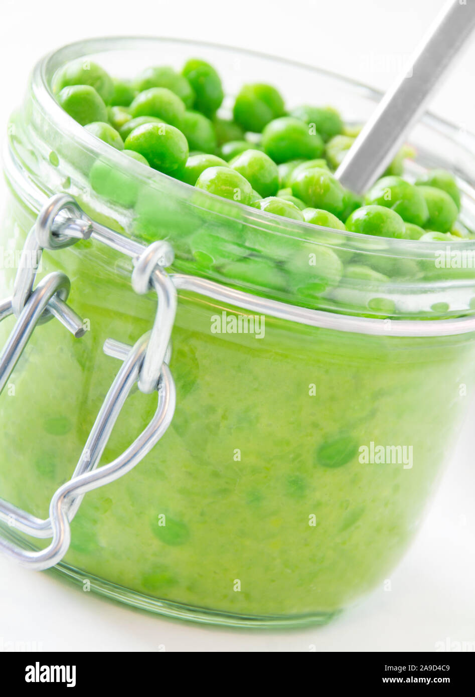Peas puree and fork close up Stock Photo