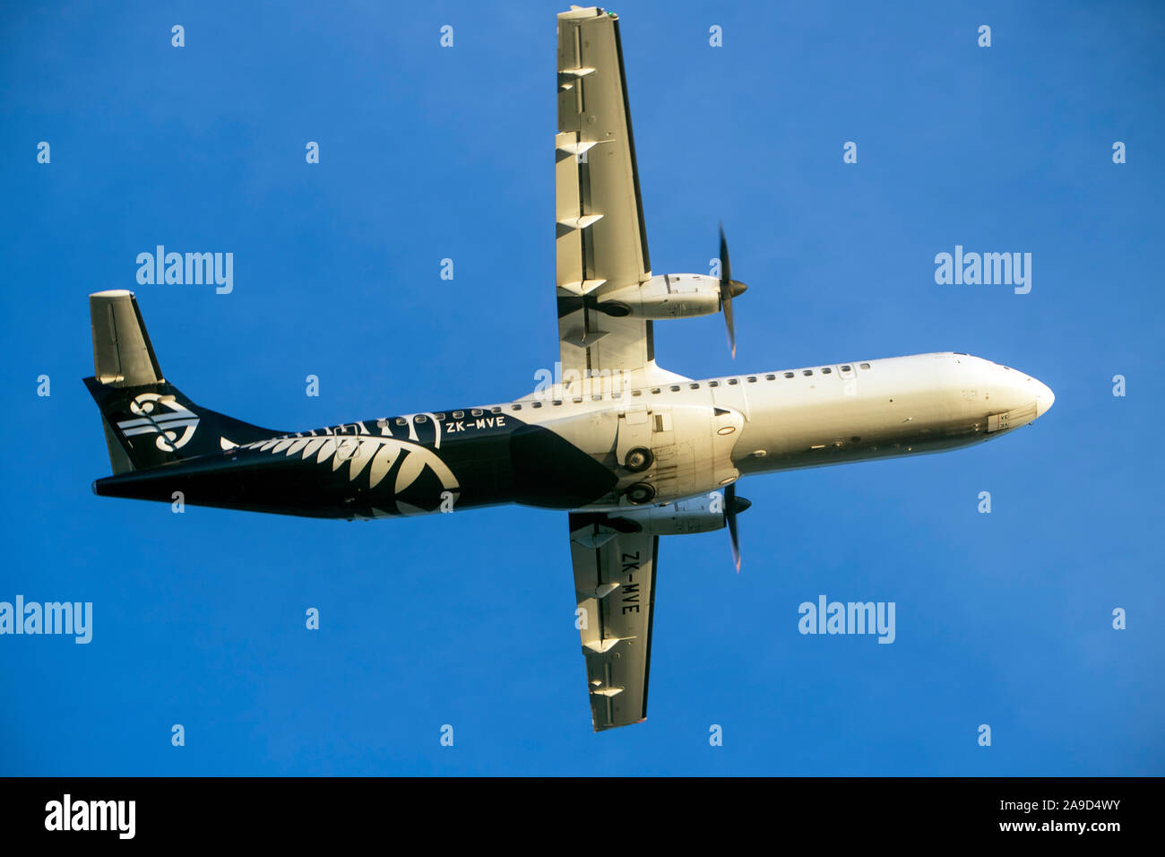 A Bombardier Q300 aircraft takes off from Nelson Airport, New Zealand Stock Photo