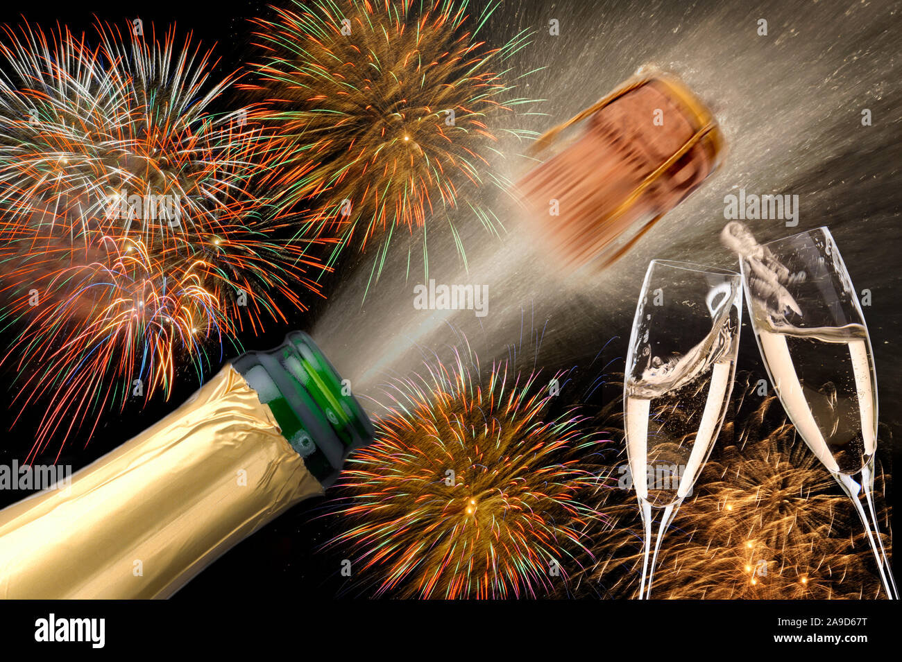 Champagne bottle with popping cork and clinking glasses, brilliant fireworks in the background, New Year 2019 Stock Photo