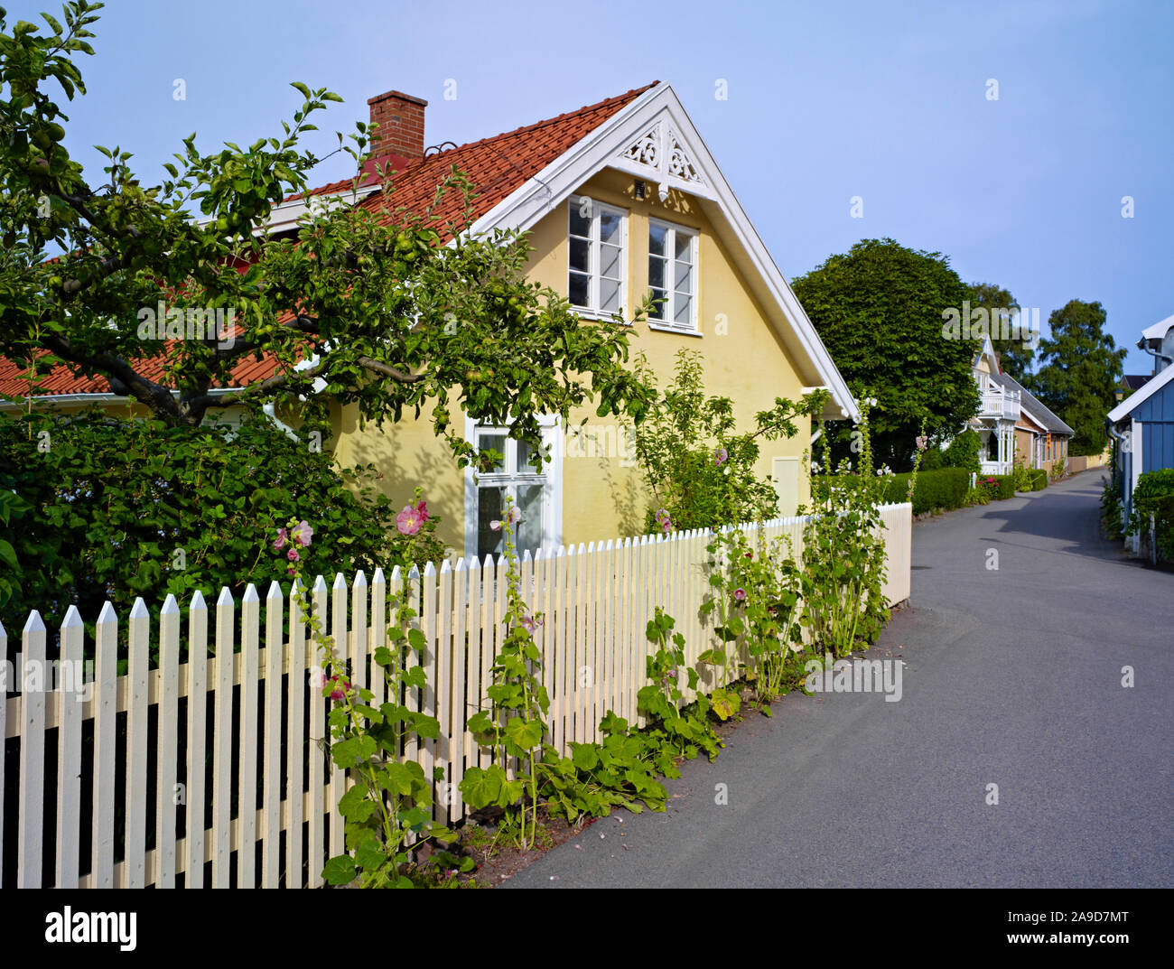 Garden fence with hollyhocks hi-res stock photography and images - Alamy