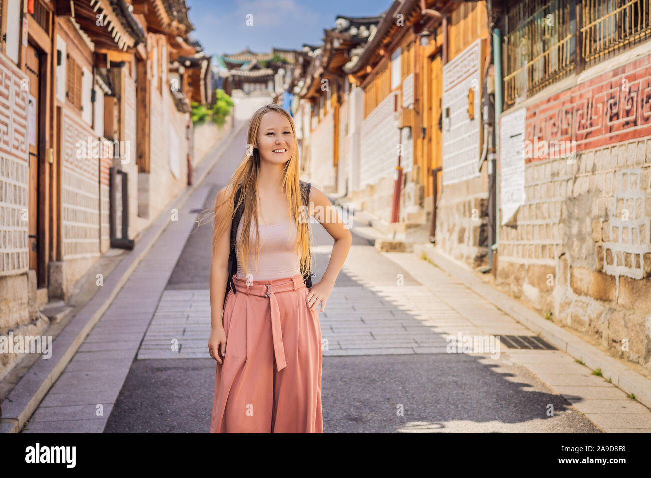 Young woman tourist in Bukchon Hanok Village is one of the famous place ...