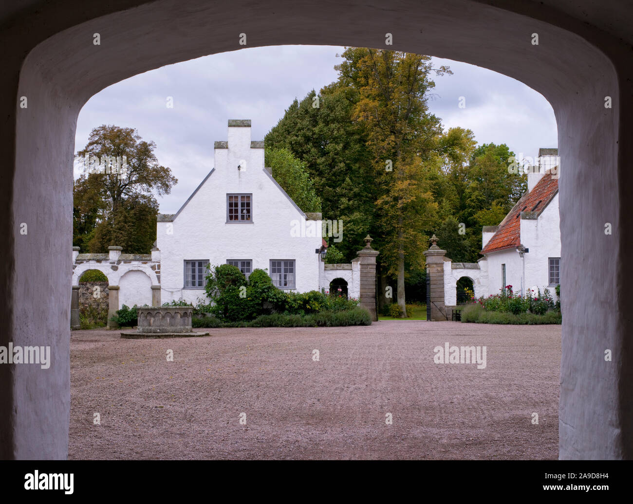 Sweden, Scania, Bosjö Abbey near Höör on Lake Ringsjön, view through ...