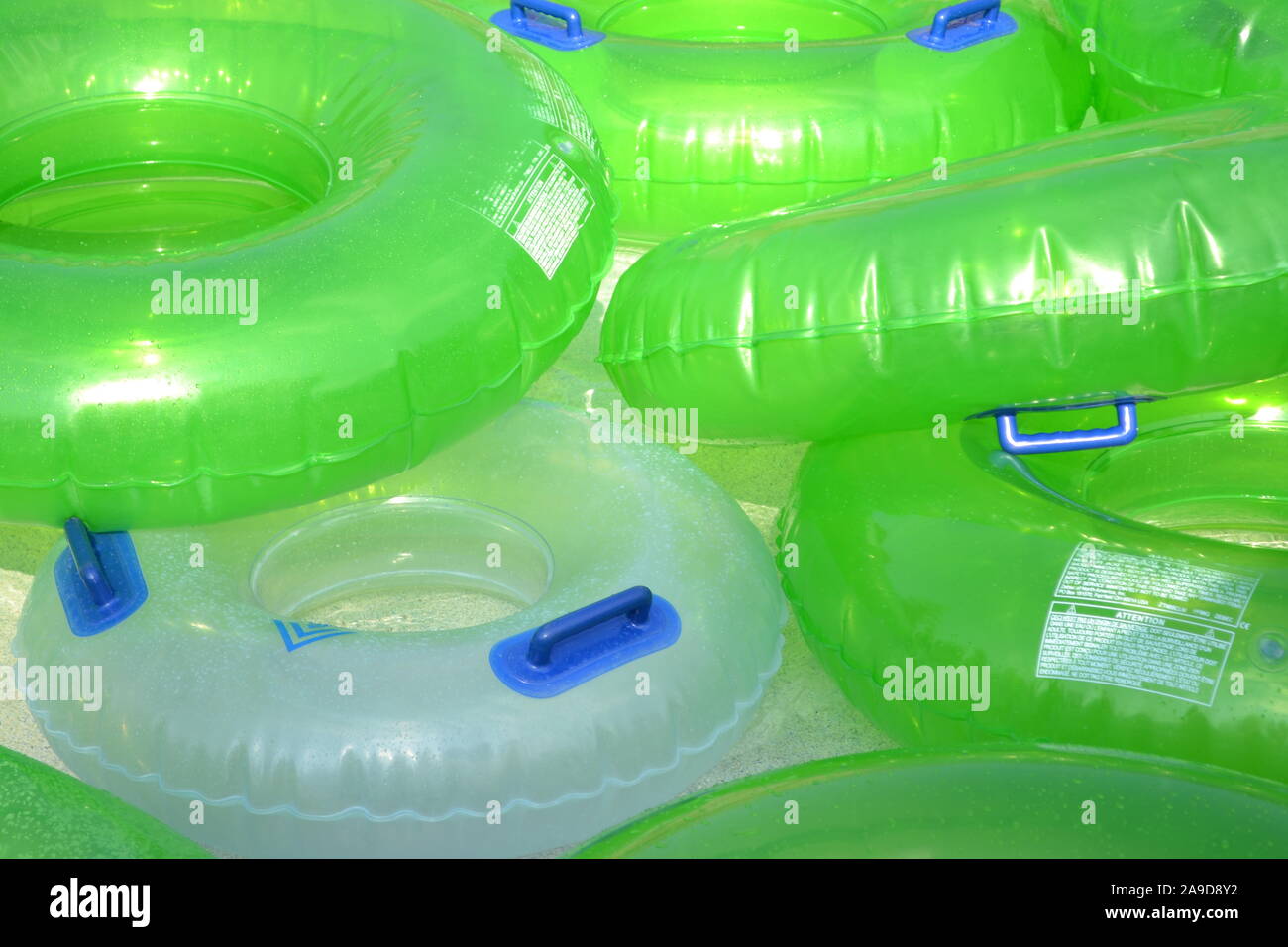 Colourful tubes on lazy river Stock Photo - Alamy
