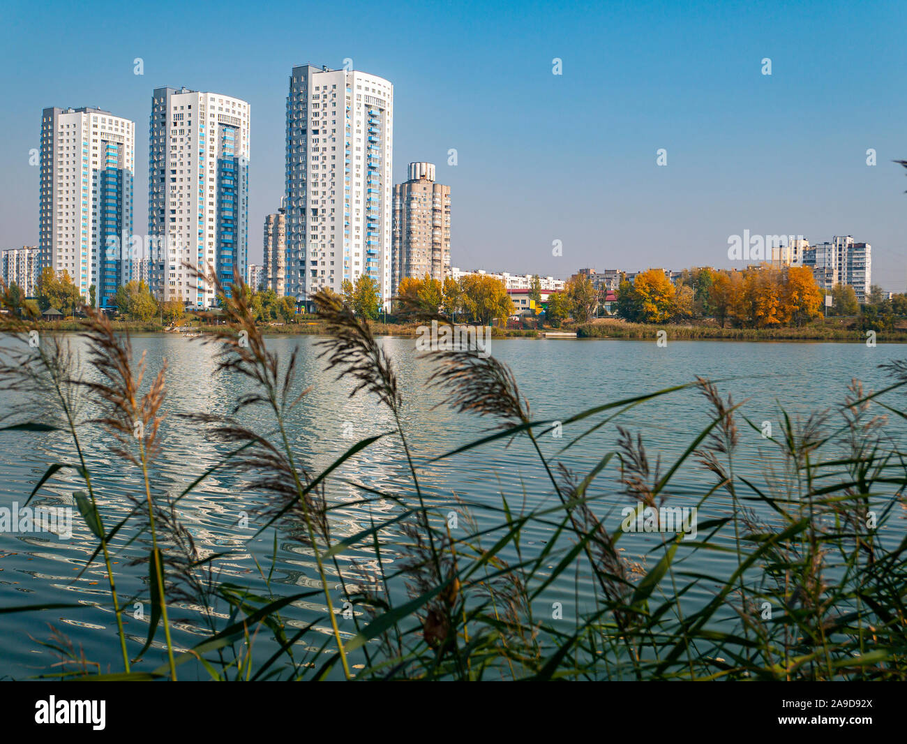 Image showcasing High-rise residential buildings of the city on the lake. City skyline ...