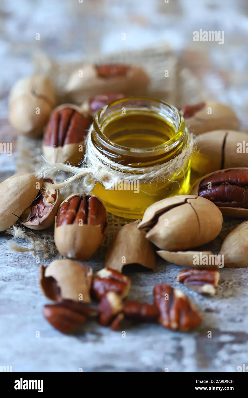 Selective focus. Pecan oil. Pecans Pecan oil production concept. Macro