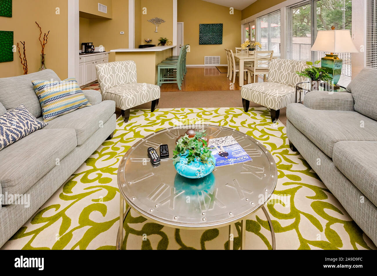 The leasing office includes a clubhouse with couches and a television