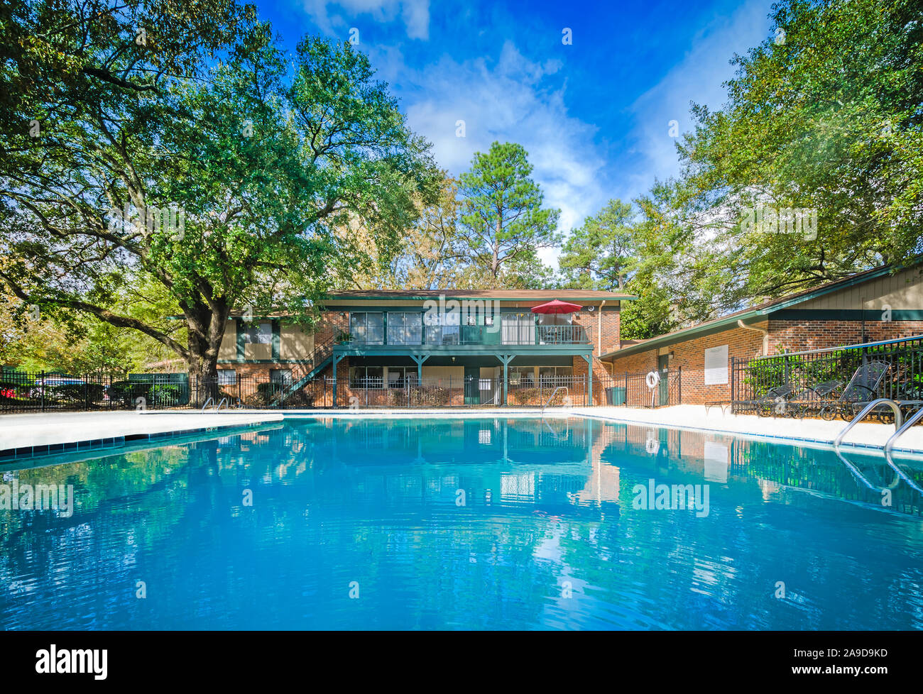 A built-in swimming pool is one of the amenities available to residents at Autumn Woods apartment homes, November 27, 2015, in Mobile, Alabama. Stock Photo