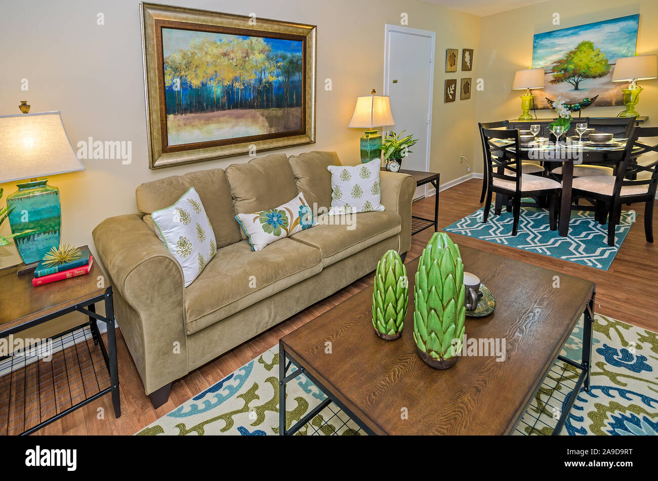 The dining room and living room showcase the open floor plan at Autumn