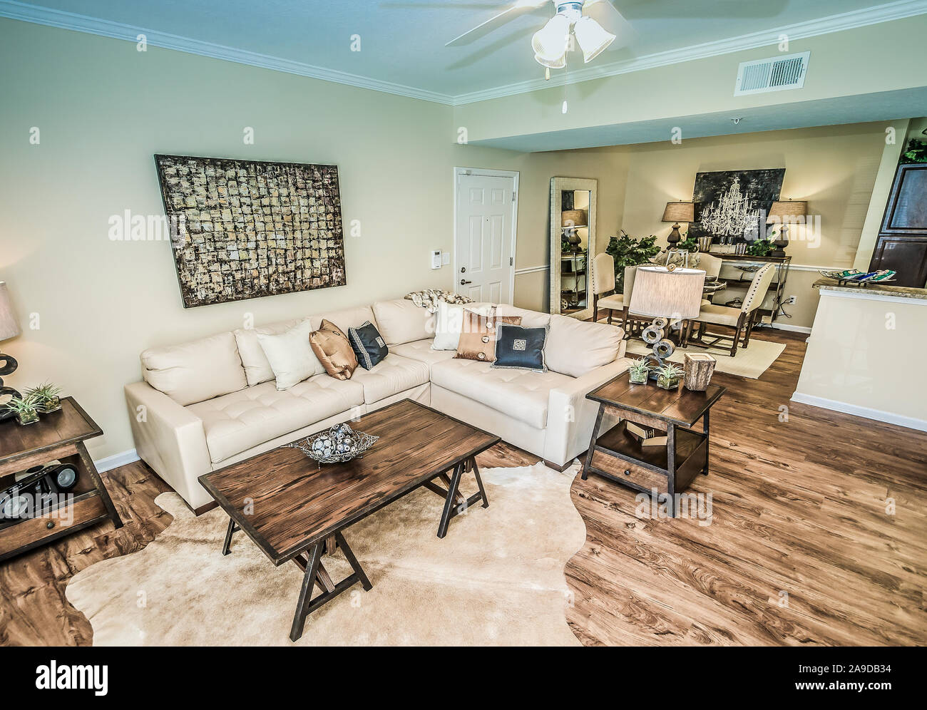 The living room and dining room is pictured at Cypress Cove Apartment Homes in Mobile, Alabama