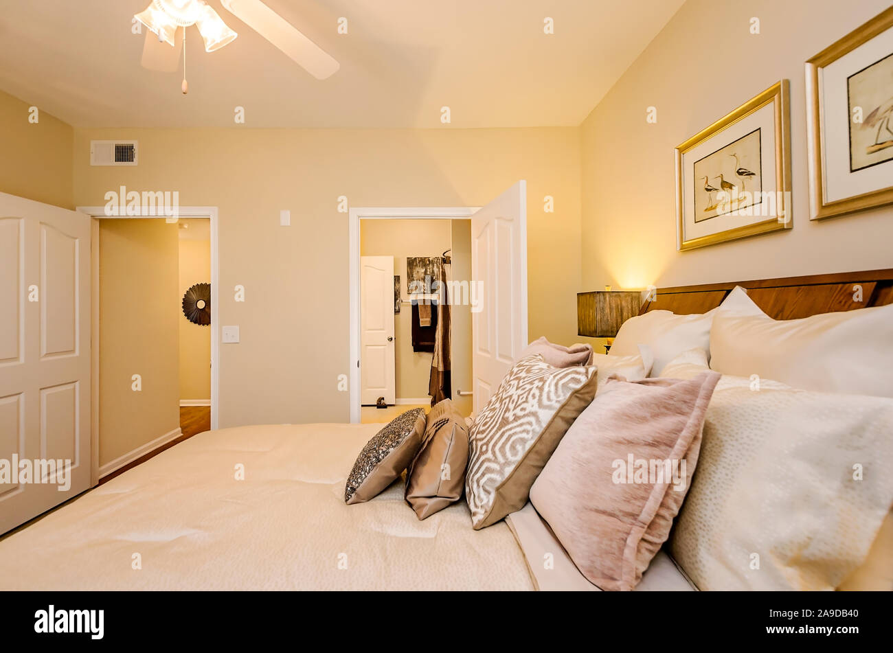 A master bedroom with master bathroom is pictured at Cypress Cove