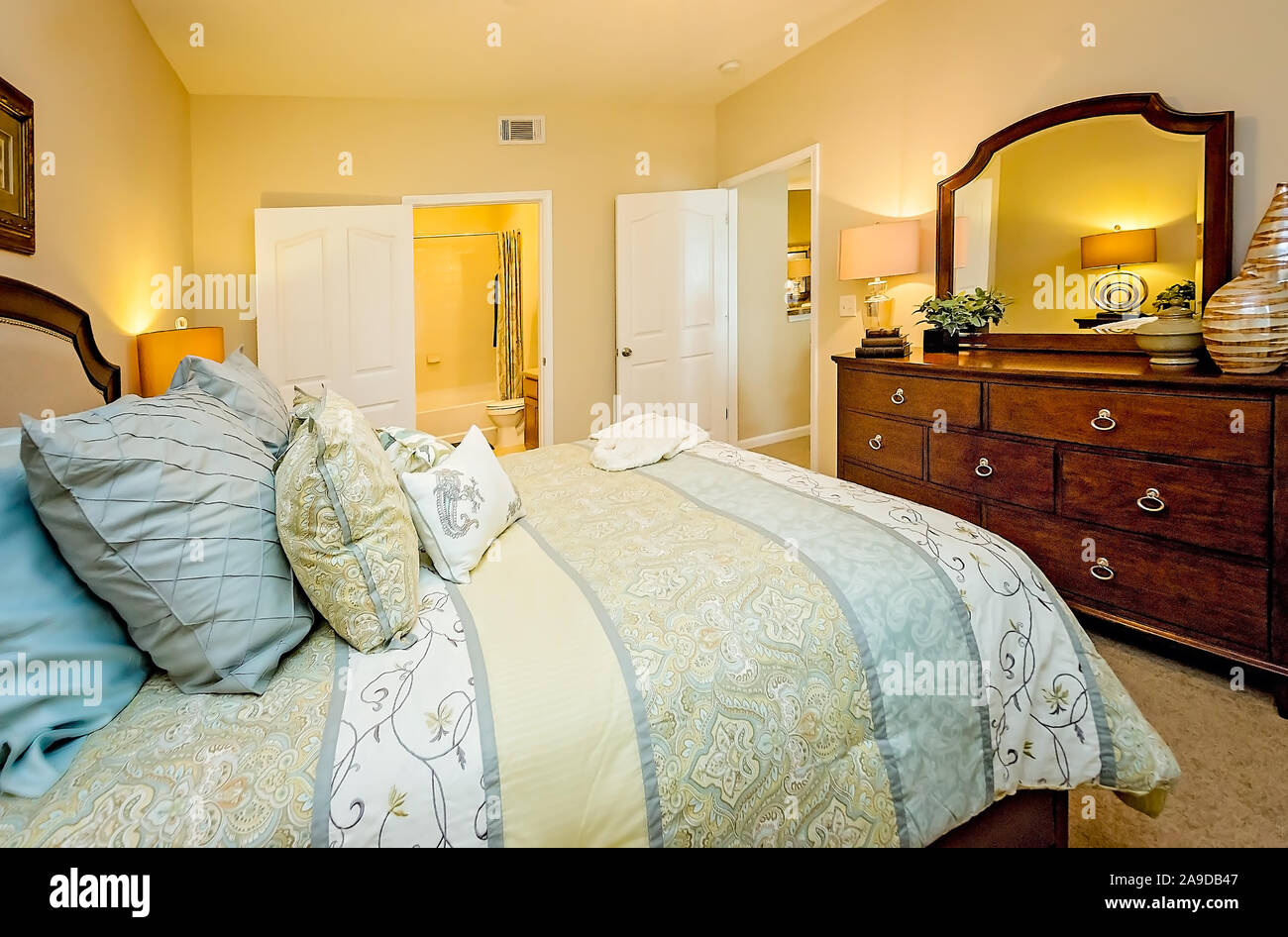 A master bedroom with master bathroom is pictured at Cypress Cove