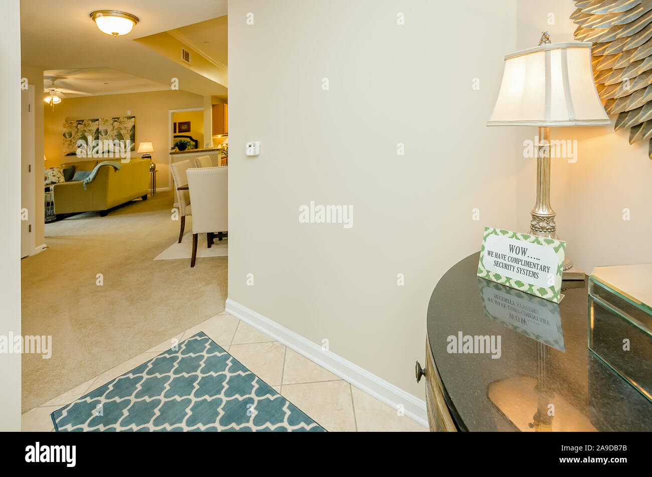 The living room is visible from the foyer at Cypress Cove Apartment