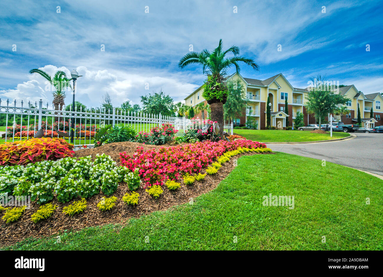 A flowerbed beautifies the entrance at Cypress Cove Apartment Homes in Mobile, Alabama Stock